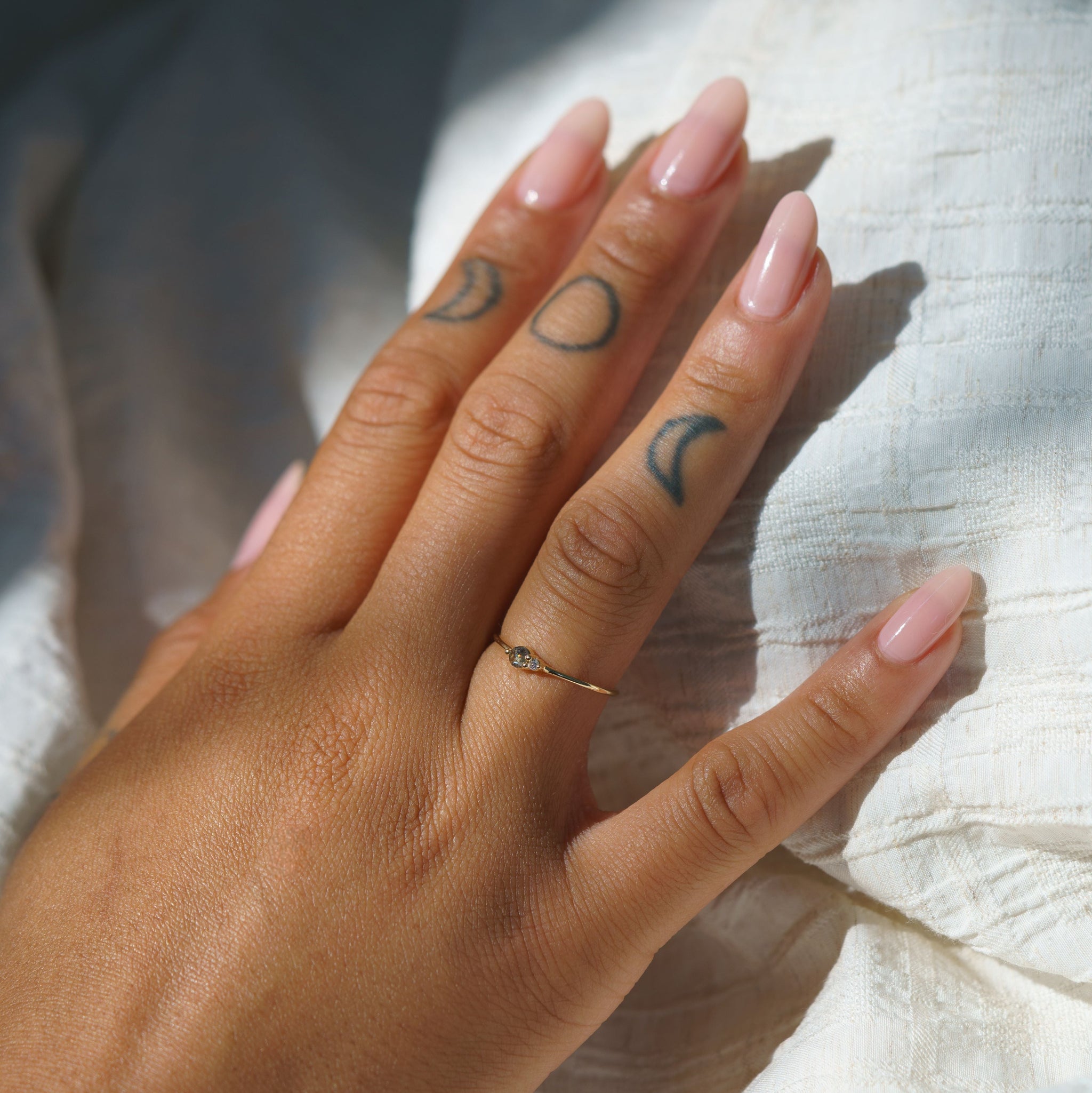 Salt & Pepper Diamond Arktos Ring set in 14k yellow gold modeled on a hand