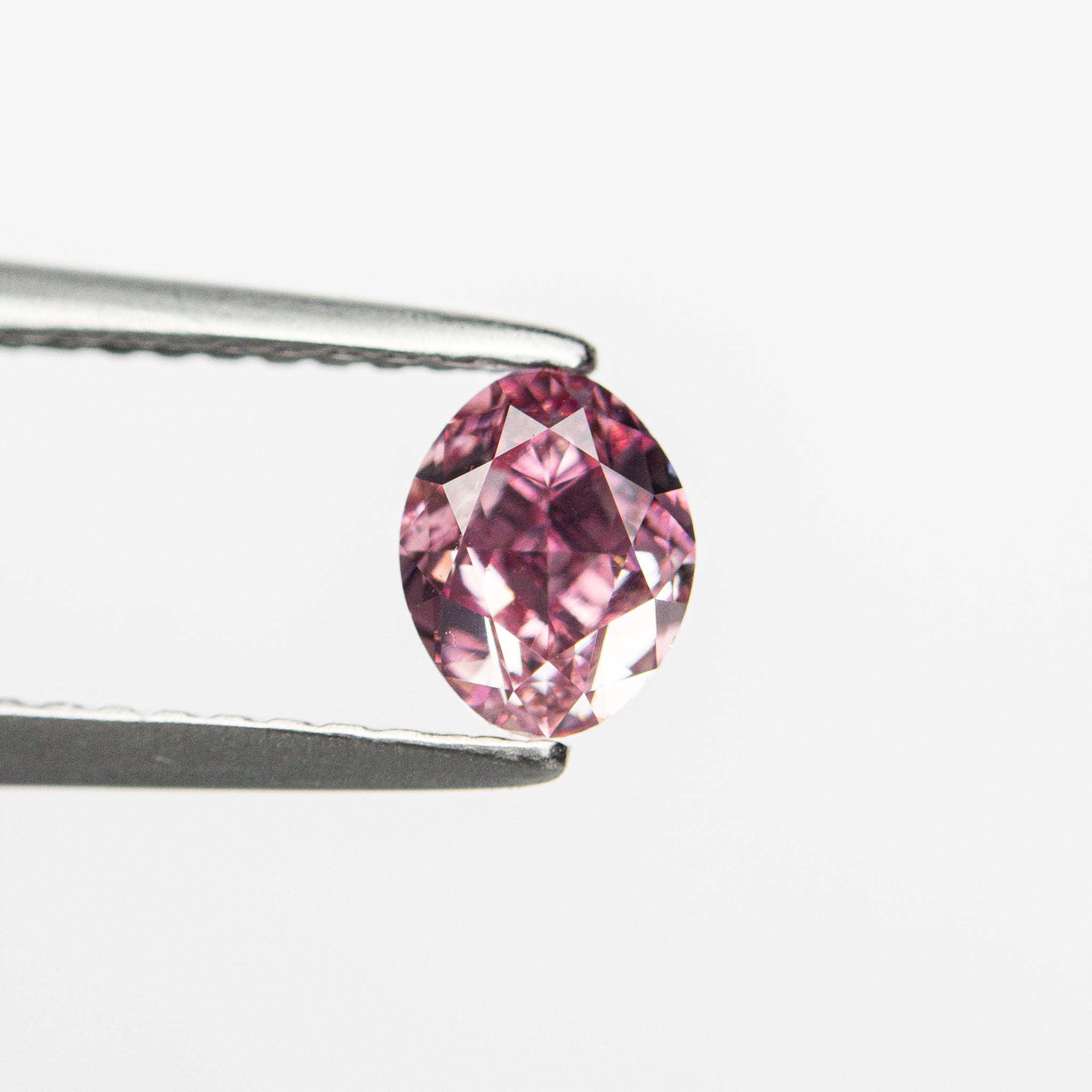 0.61ct 5.57x4.44x3.13mm GIA VS2 Fancy Vivid Purplish Pink Oval