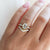  Oval Champagne Salt & Pepper Diamond Ring paired with diamond gold band being worn on hand front detailed view
