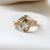  Oval Champagne Salt & Pepper Diamond Ring paired with wave diamond ring