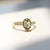  Oval Champagne Salt & Pepper Diamond Ring in sunlight quarter front view