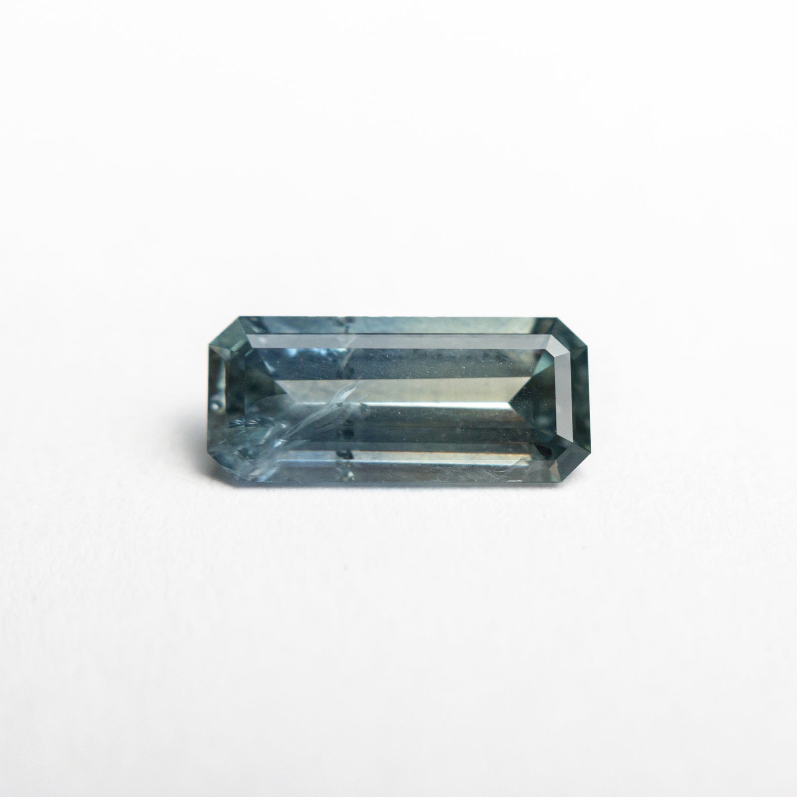 0.99ct 9.05x3.97x2.58mm Cut Corner Rectangle Step Cut Sapphire 23081-01