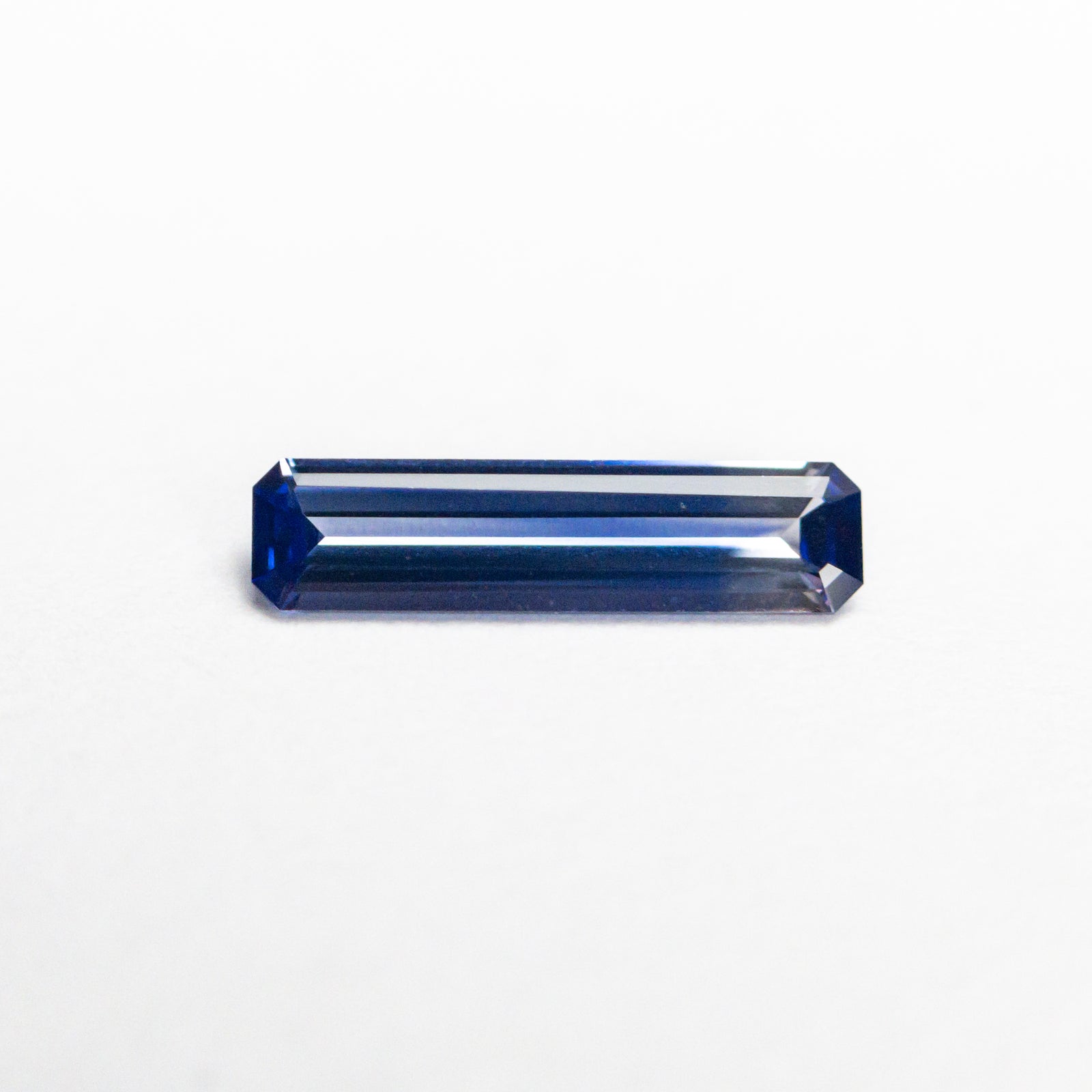 0.32ct 8.95x2.25x1.39mm Cut Corner Rectangle Step Cut Sapphire 23166-01