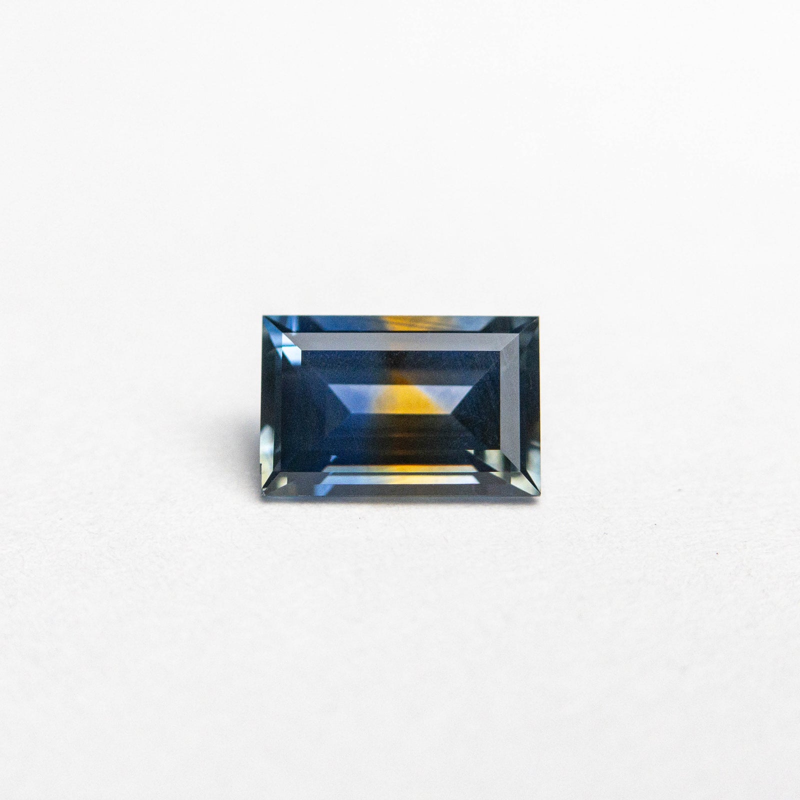 0.54ct 5.66x3.70x2.41mm Rectangle Step Cut Sapphire 23470-01