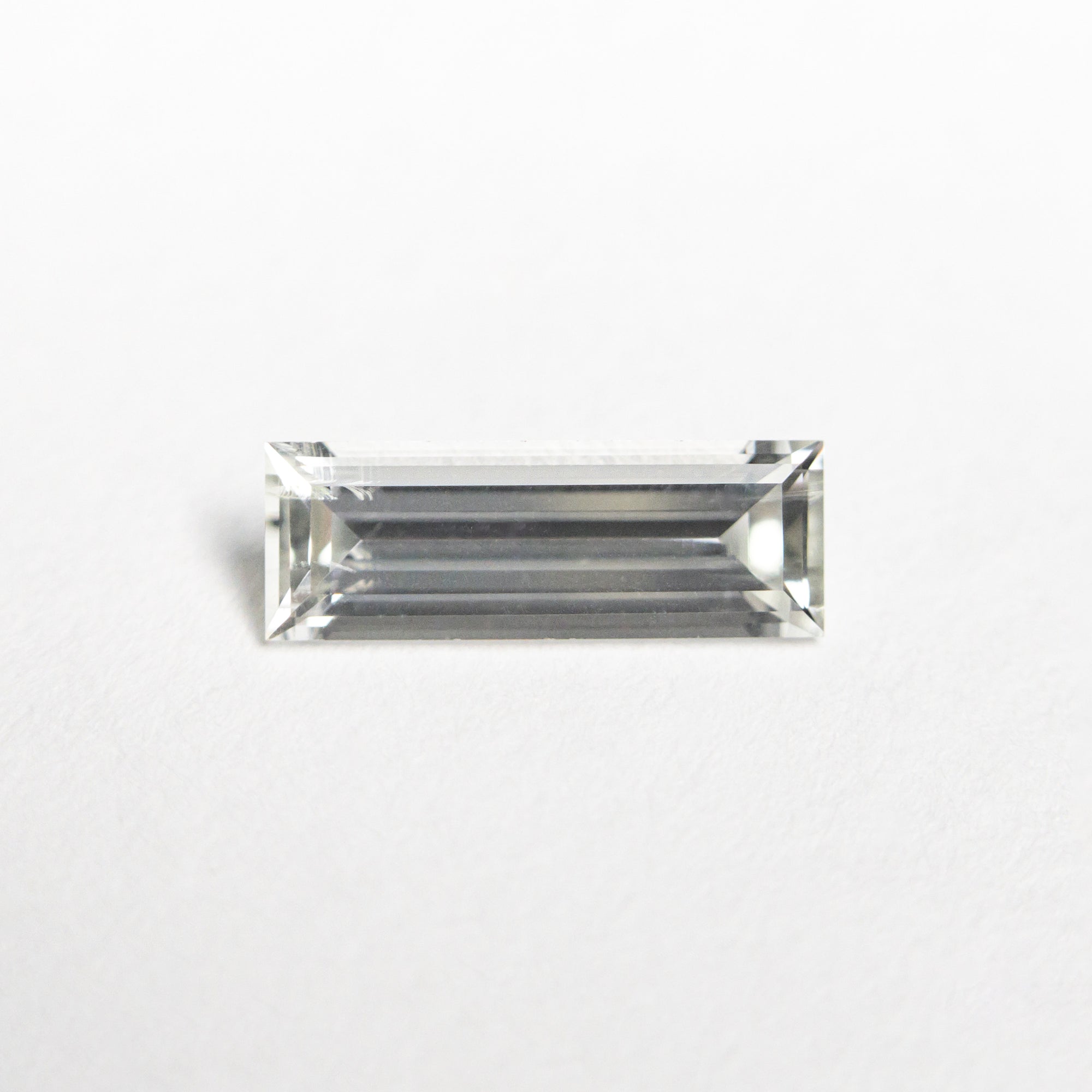 0.61ct 8.51x3.01x2.09mm Baguette Step Cut Sapphire 23775-03