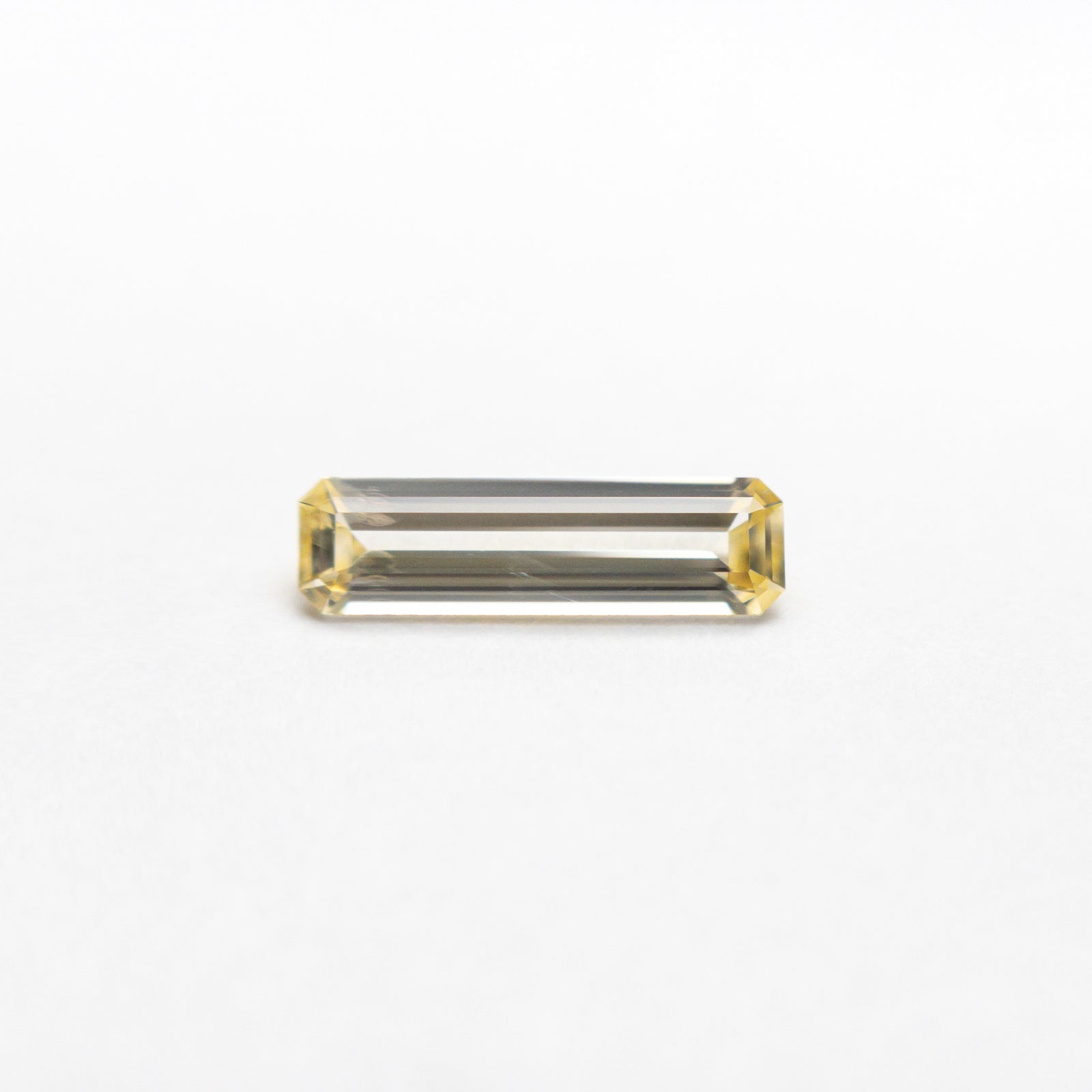 0.38ct 8.42x2.42x1.63mm Cut Corner Rectangle Step Cut Sapphire 23780-01