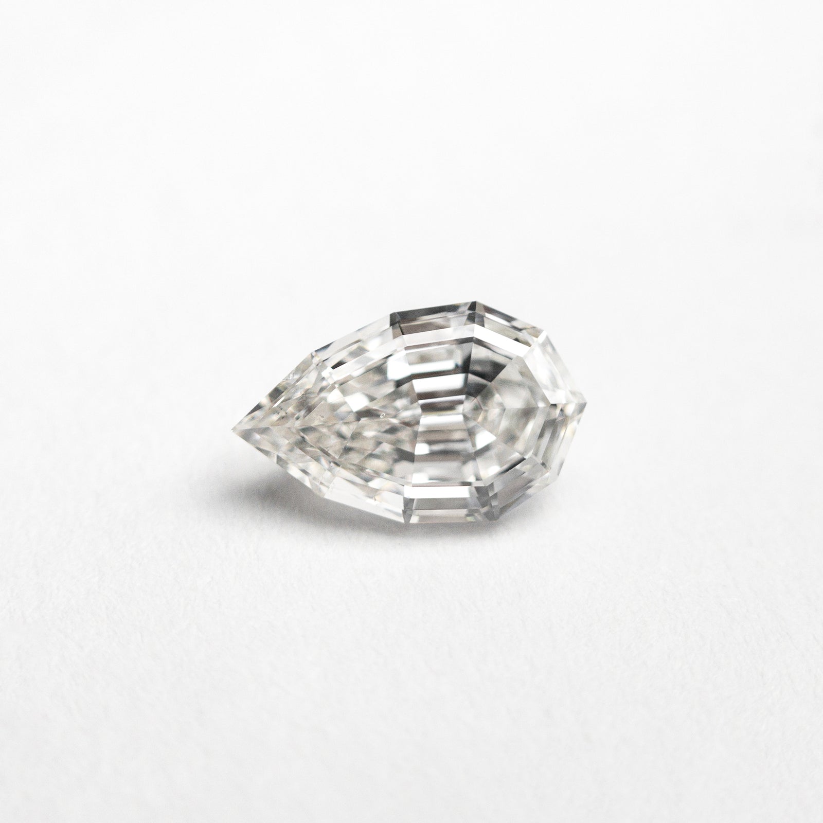 0.51ct 6.81x4.19x2.59mm SI1 H Geo Pear Step Cut 23918-01