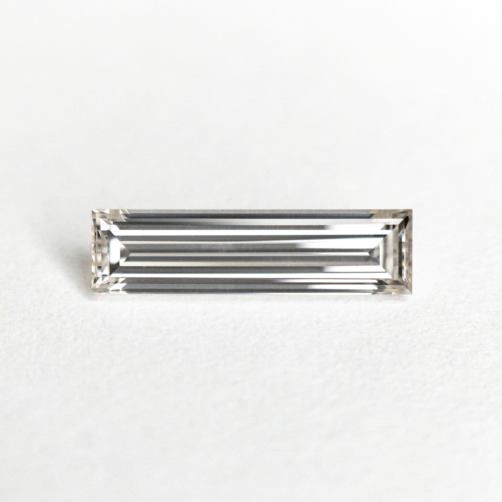 0.60ct 10.40x2.85x1.94mm GIA Internally Flawless H Baguette Step Cut 24299-01