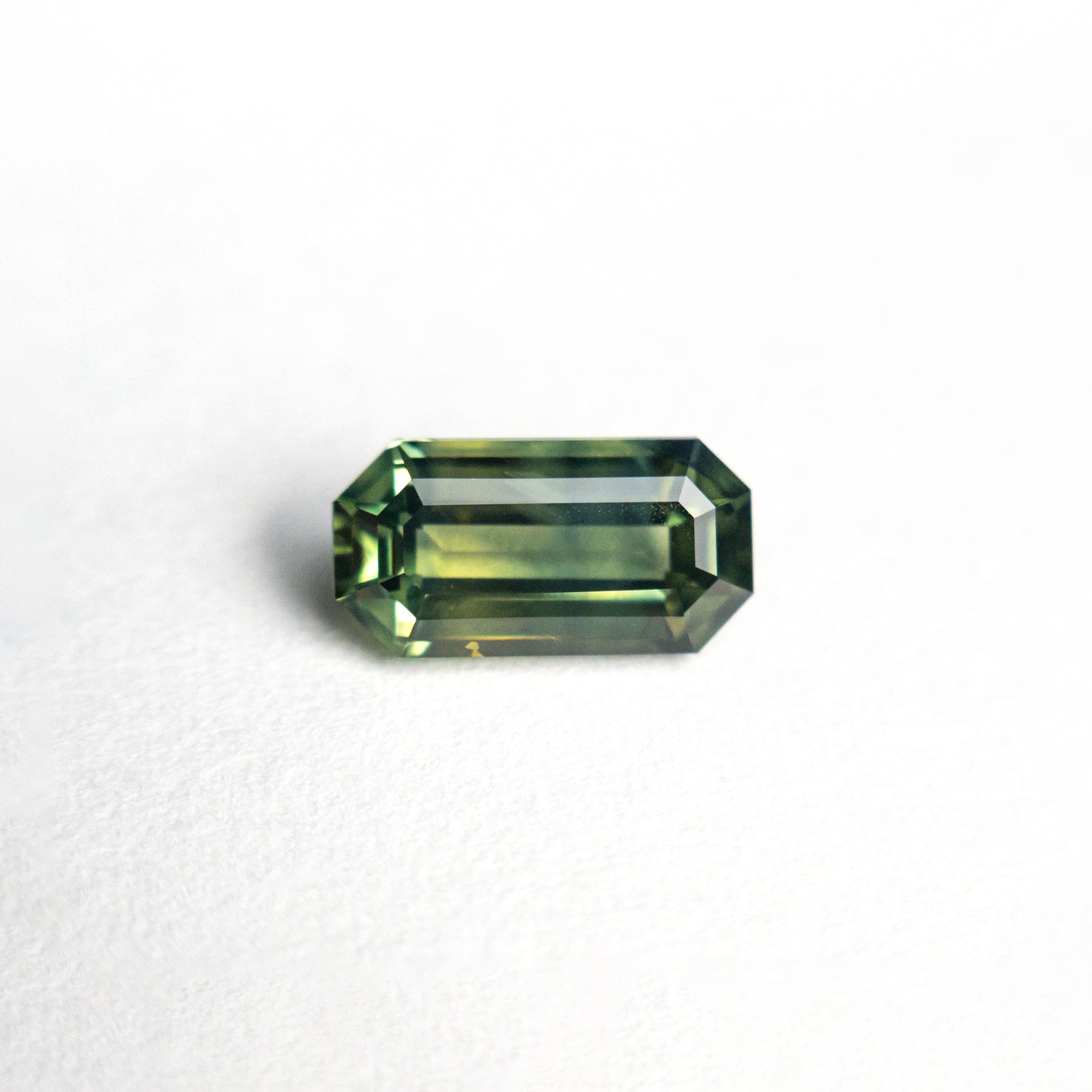 0.89ct 7.67x4.00x2.70mm Cut Corner Rectangle Step Cut Sapphire 25198-02
