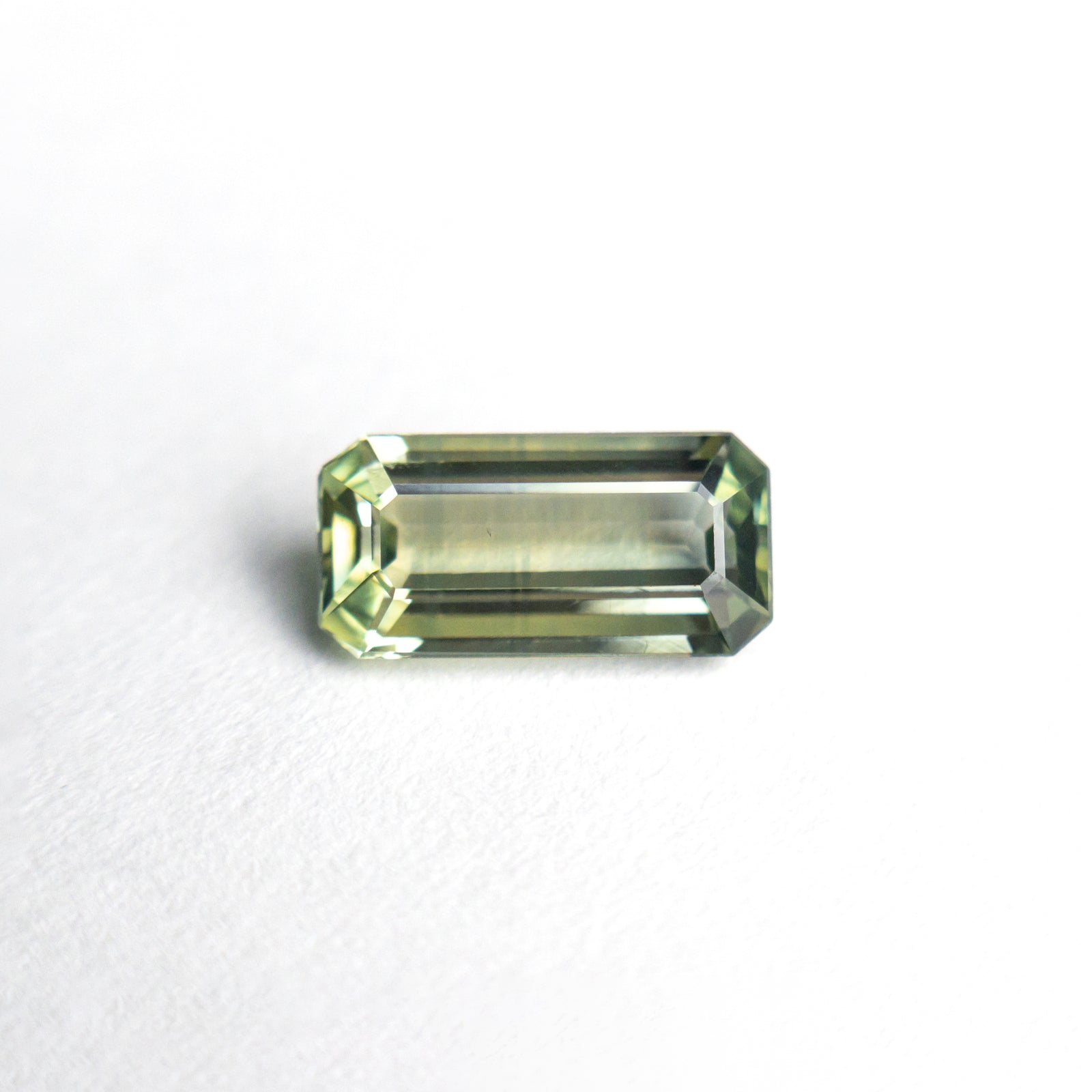 0.97ct 8.21x4.10x2.49mm Cut Corner Rectangle Step Cut Sapphire 25198-03