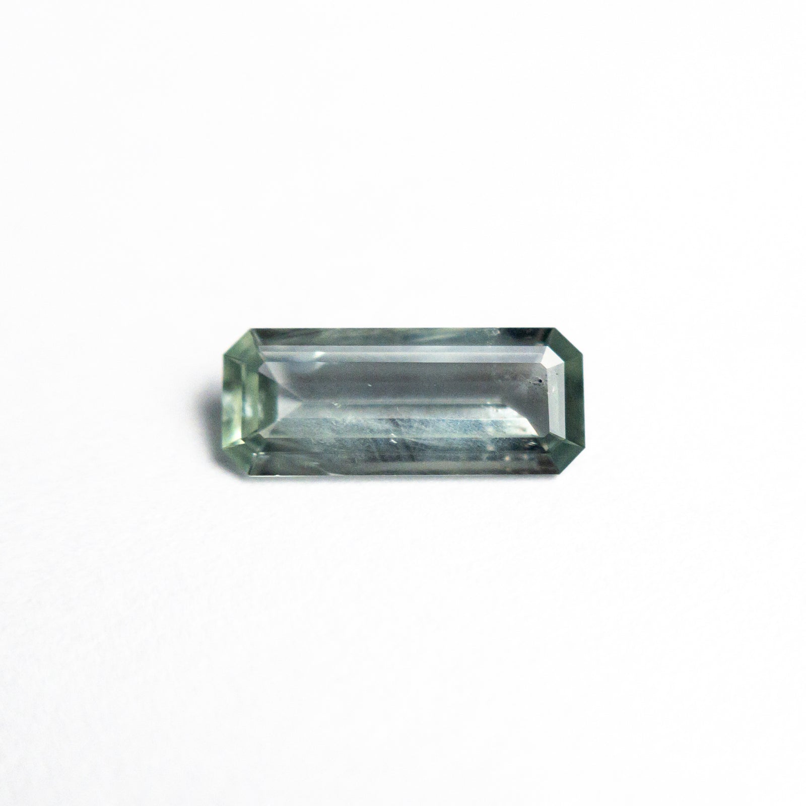 0.59ct 8.51x3.50x1.75mm Cut Corner Rectangle Step Cut Sapphire 25442-01