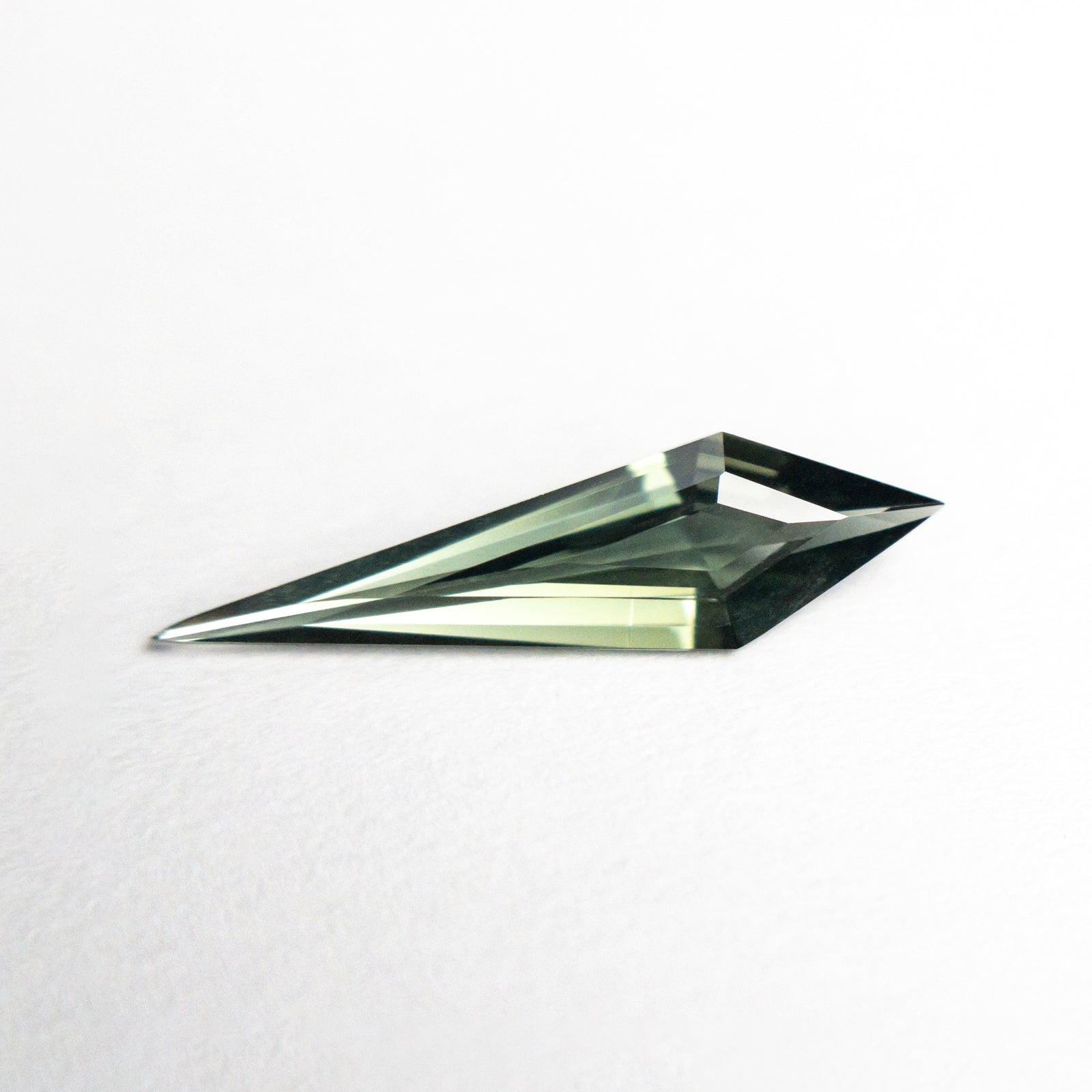 0.63ct 13.95x3.86x2.16mm Kite Step Cut Sapphire 25740-13