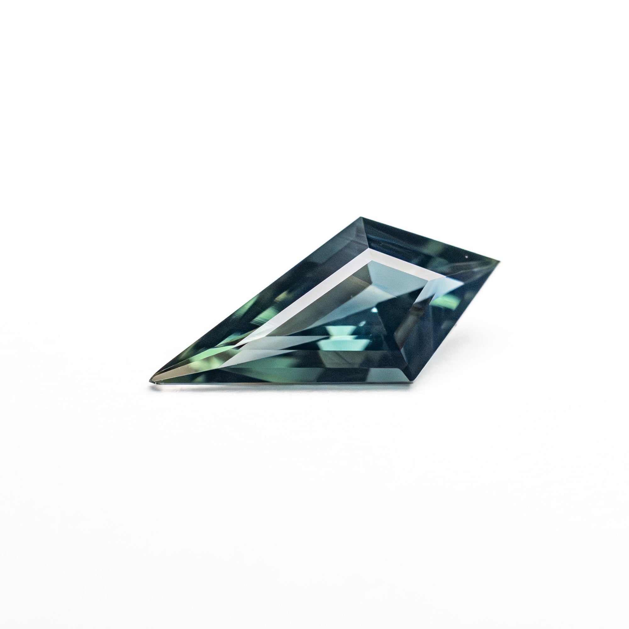 0.59ct 9.68x4.61x2.66mm Kite Step Cut Sapphire 25740-25
