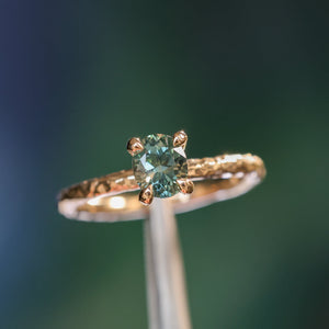 0.85ct Oval Precision Cut Ocean Blue Montana Sapphire Evergreen Carved 4 Prong Solitaire in 14k Yellow Gold