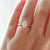 Oval diamond engagement ring on hand