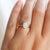 Oval diamond engagement ring on hand