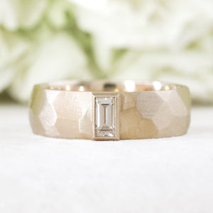 Bezel set baguette in a 14k yellow gold faceted wide wedding band 