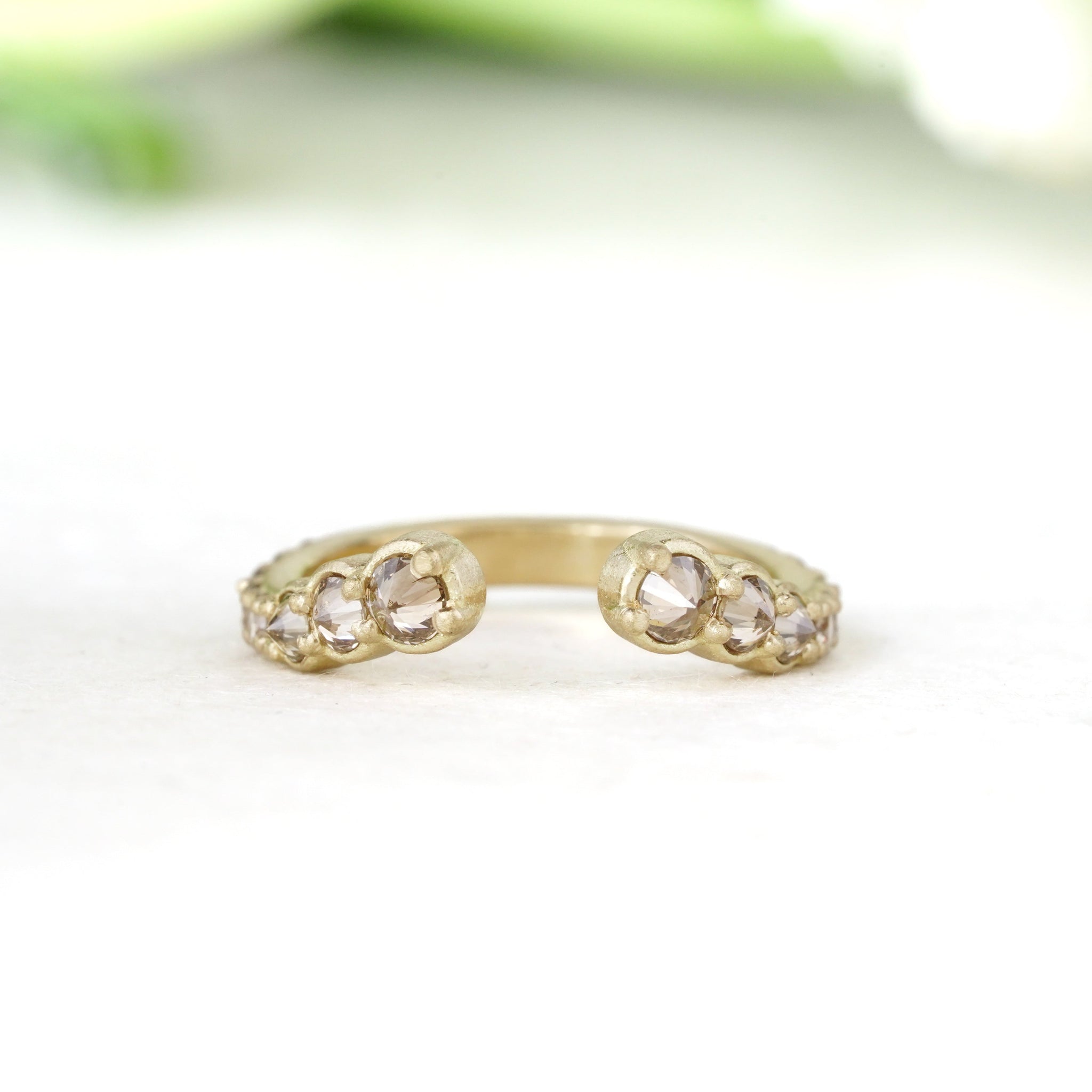 18k yellow gold open ring in a matte finish with champagne inverted diamonds