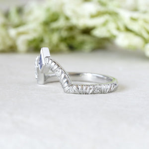 Contour wedding band with round white diamonds and blue sapphire