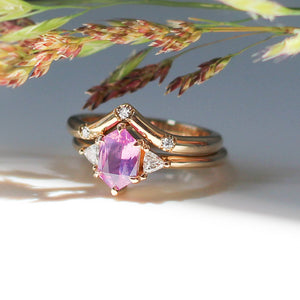 Hexagon Cut Pink Sapphire Ring with gold wave band and grains quarter side view