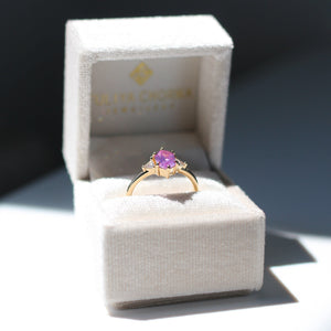 Hexagon Cut Pink Sapphire Ring in jewellery box profile view