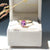 Hexagon Cut Pink Sapphire Ring in jewellery box in sunlight