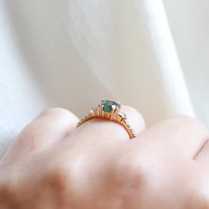 Cut Corner Rectangle Step Cut Green Sapphire Ring profile view on hand 