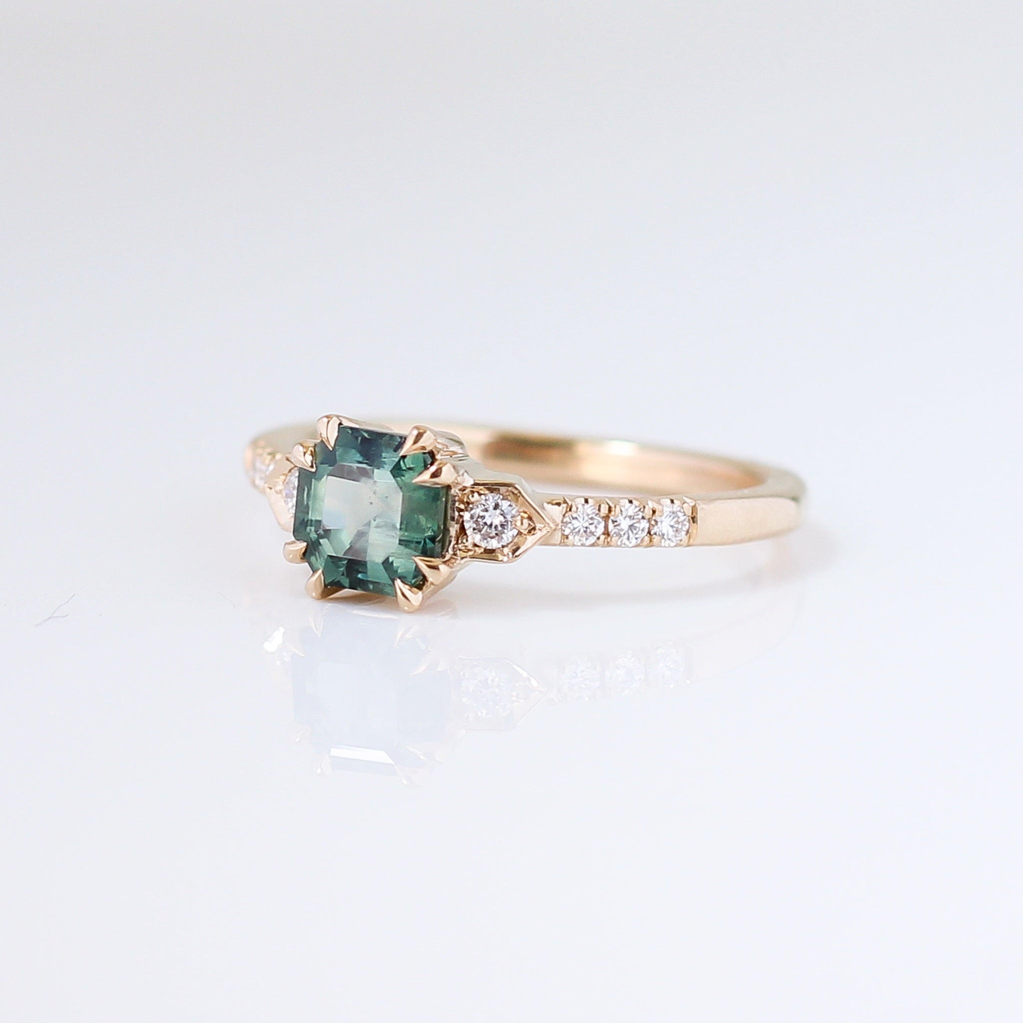 Cut Corner Rectangle Step Cut Green Sapphire Ring quarter side view