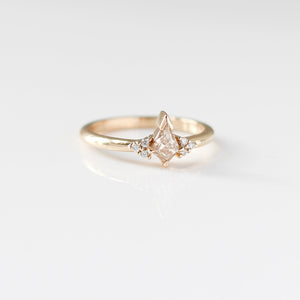 Champagne kite cut diamond ring with white diamond accents, front view