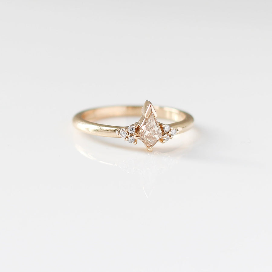 Champagne kite cut diamond ring with white diamond accents, front view