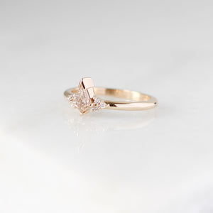 Champagne kite cut diamond ring with white diamond accents, quarter view