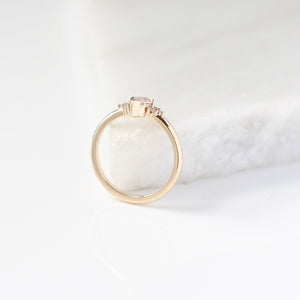 Champagne kite cut diamond ring with white diamond accents, side view