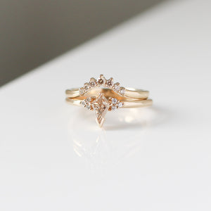 Champagne kite cut diamond ring with white diamond accents and a diamond contour band, front view