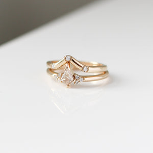 Champagne kite cut diamond ring with white diamond accents and a pointed diamond band, front view