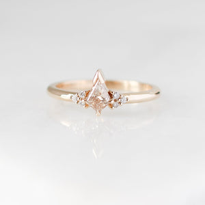 Champagne kite cut diamond ring with white diamond accents, front view