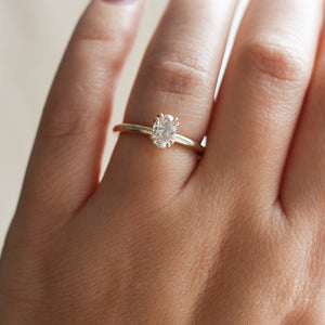 yellow gold diamond solitiaire ring on hand top view