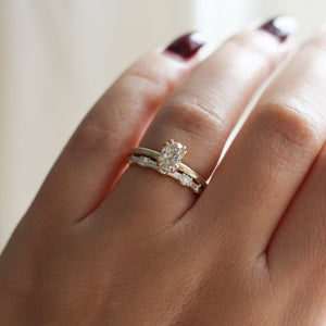 yellow gold diamond ring with diamond wedding band on hand