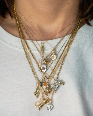 DMJ Charm Collection modeled on chains