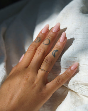 Salt & Pepper Diamond Arktos Ring set in 14k yellow gold modeled on a hand