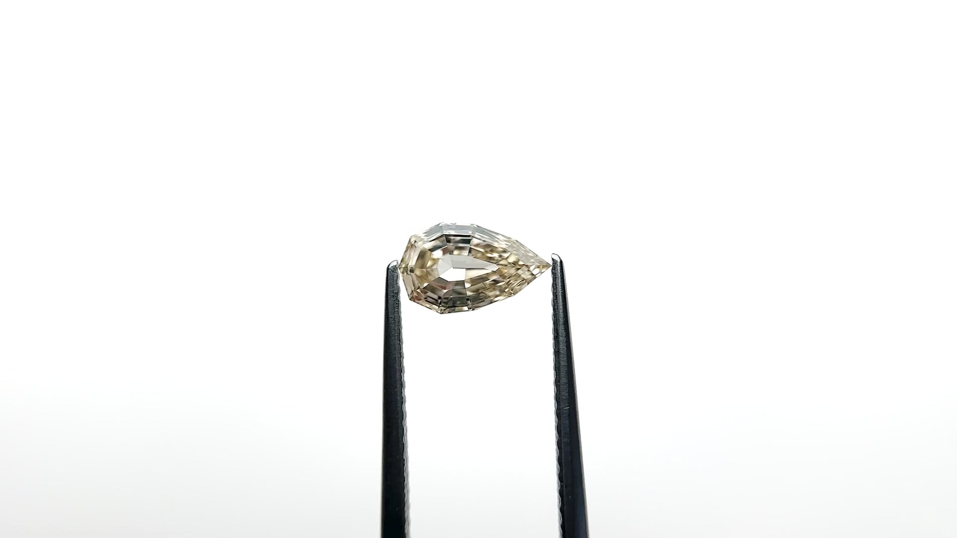 1.21ct 9.11x5.57x3.36mm VVS2 Fancy Light Yellowish Brown Geo Pear Step Cut 28047-01