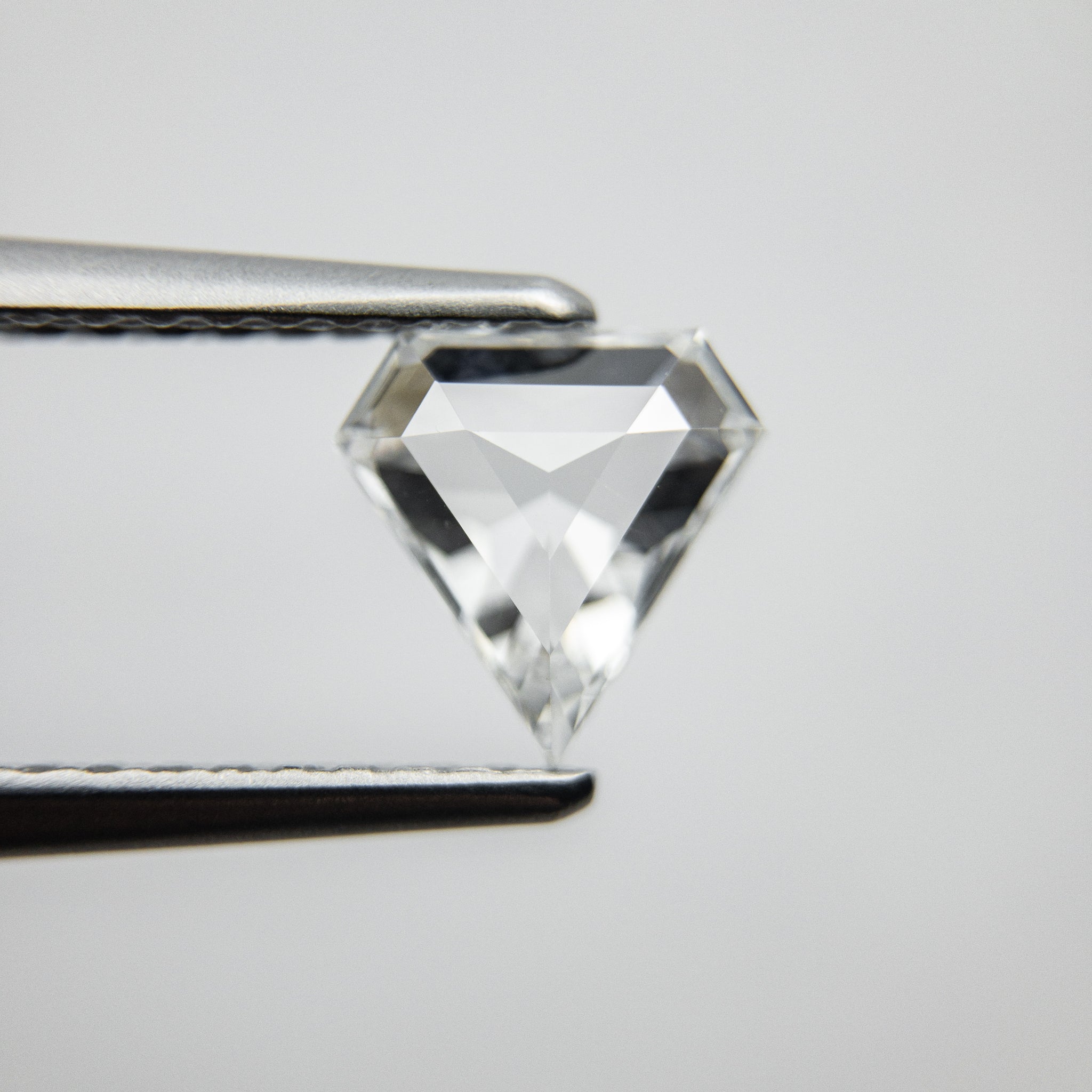 0.64ct 6.57x6.44x2.34mm Shield Step Cut 18129-09 - Misfit