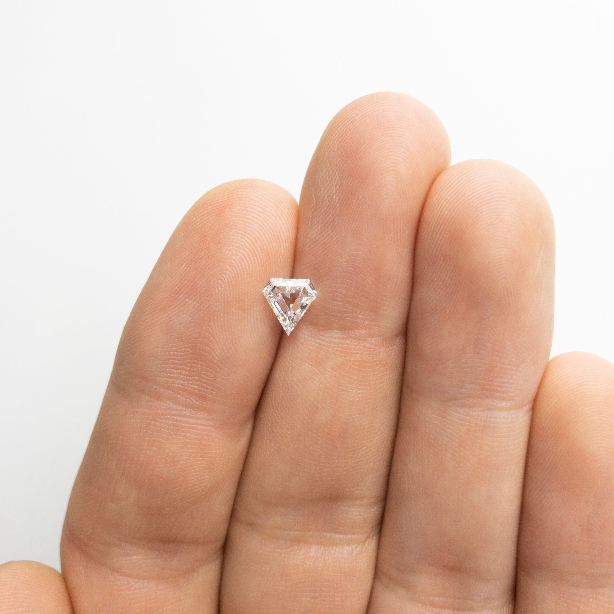 0.64ct 6.57x6.44x2.34mm Shield Step Cut 18129-09 - Misfit Diamonds