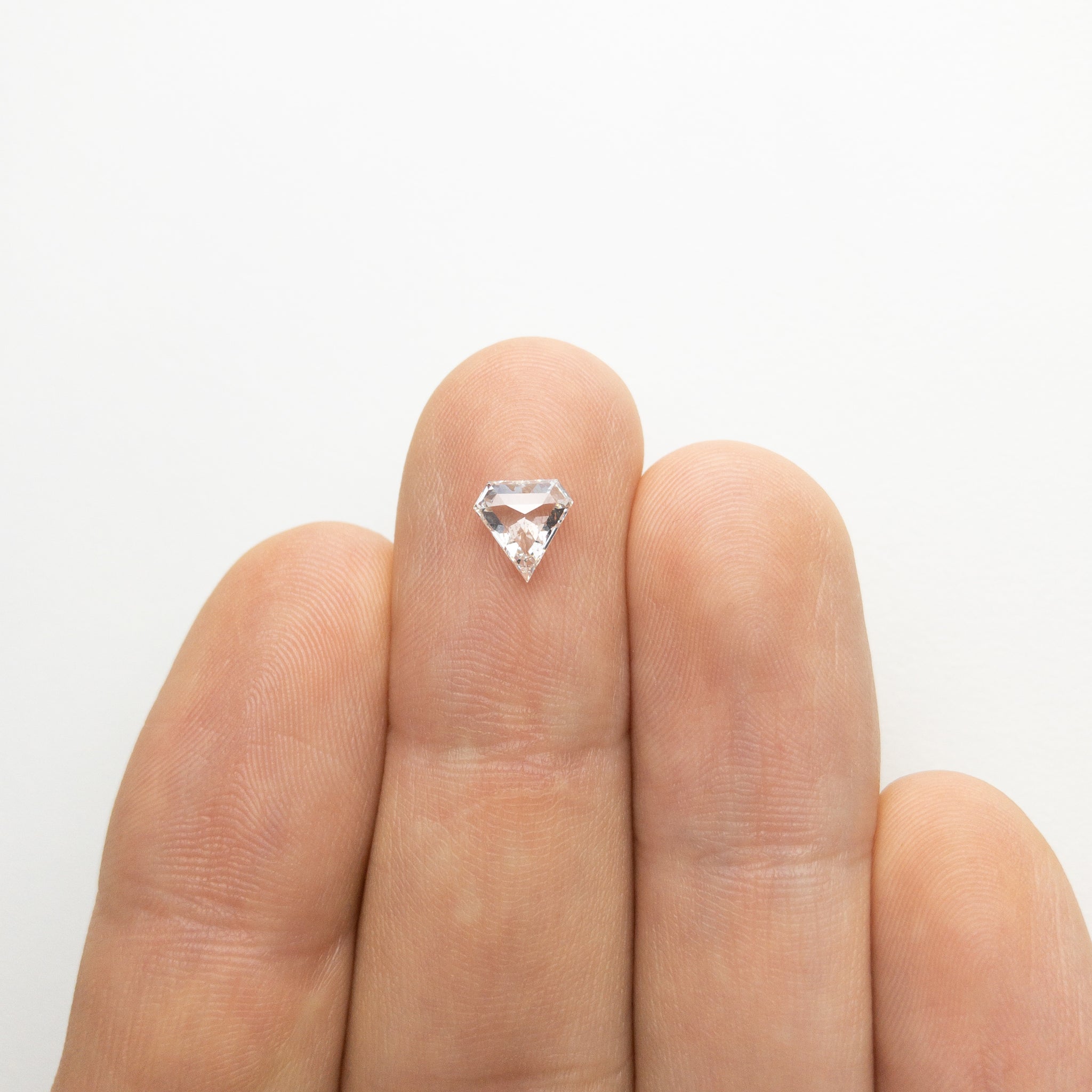 0.64ct 6.57x6.44x2.34mm Shield Step Cut 18129-09 - Misfit Diamonds