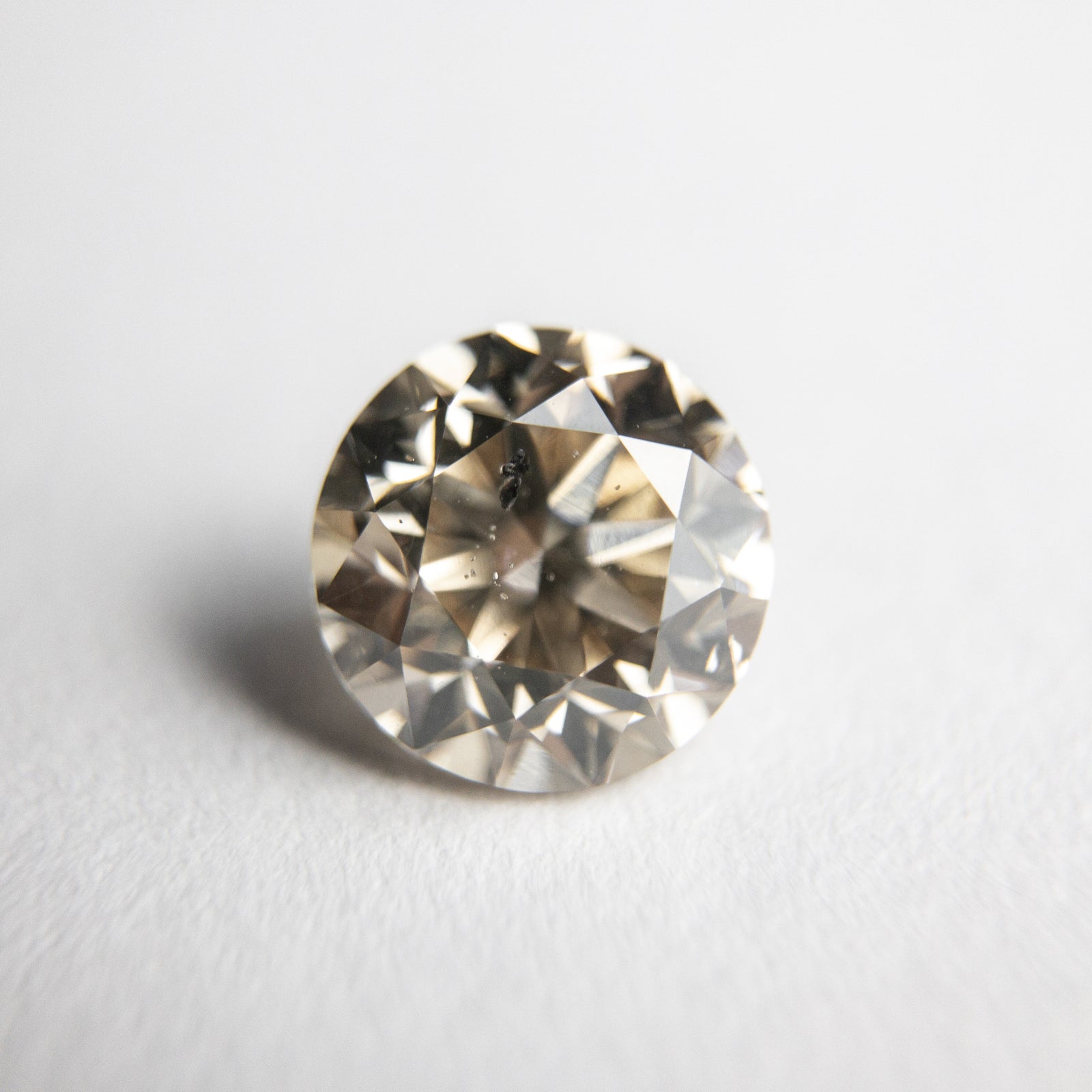 1.50ct 6.90x6.88x5.03mm I1 Champagne Round Brilliant 18305-01 - Misfit Diamonds