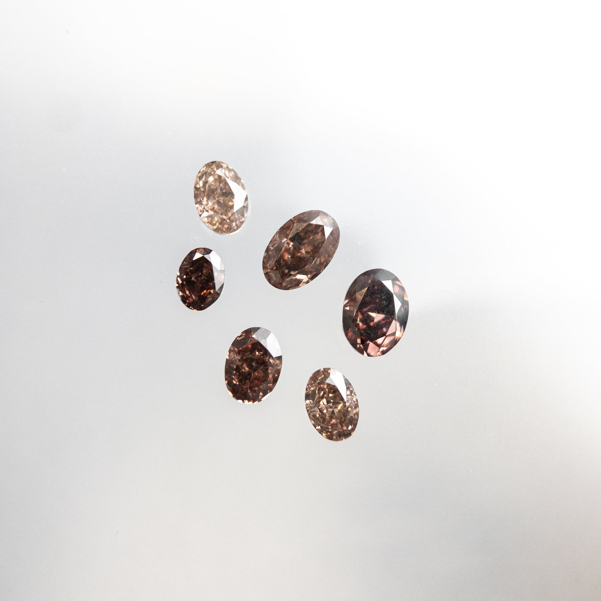 6pc 1.09cttw 4.49-3.16mm Argyle Champagne Pink Oval Brilliant Melee 18519-05 - Misfit Diamonds