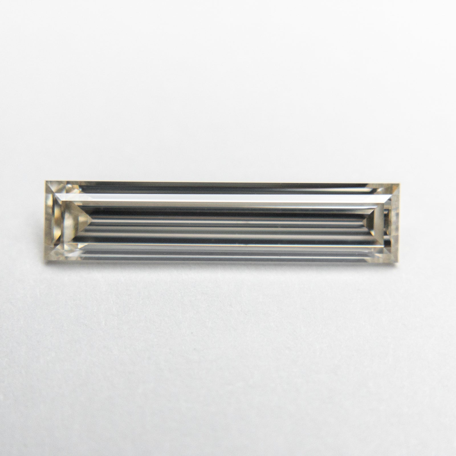 1.04ct 14.35x3.24x2.10mm VVS2 K Baguette Step Cut 18604-01 - Misfit Diamonds