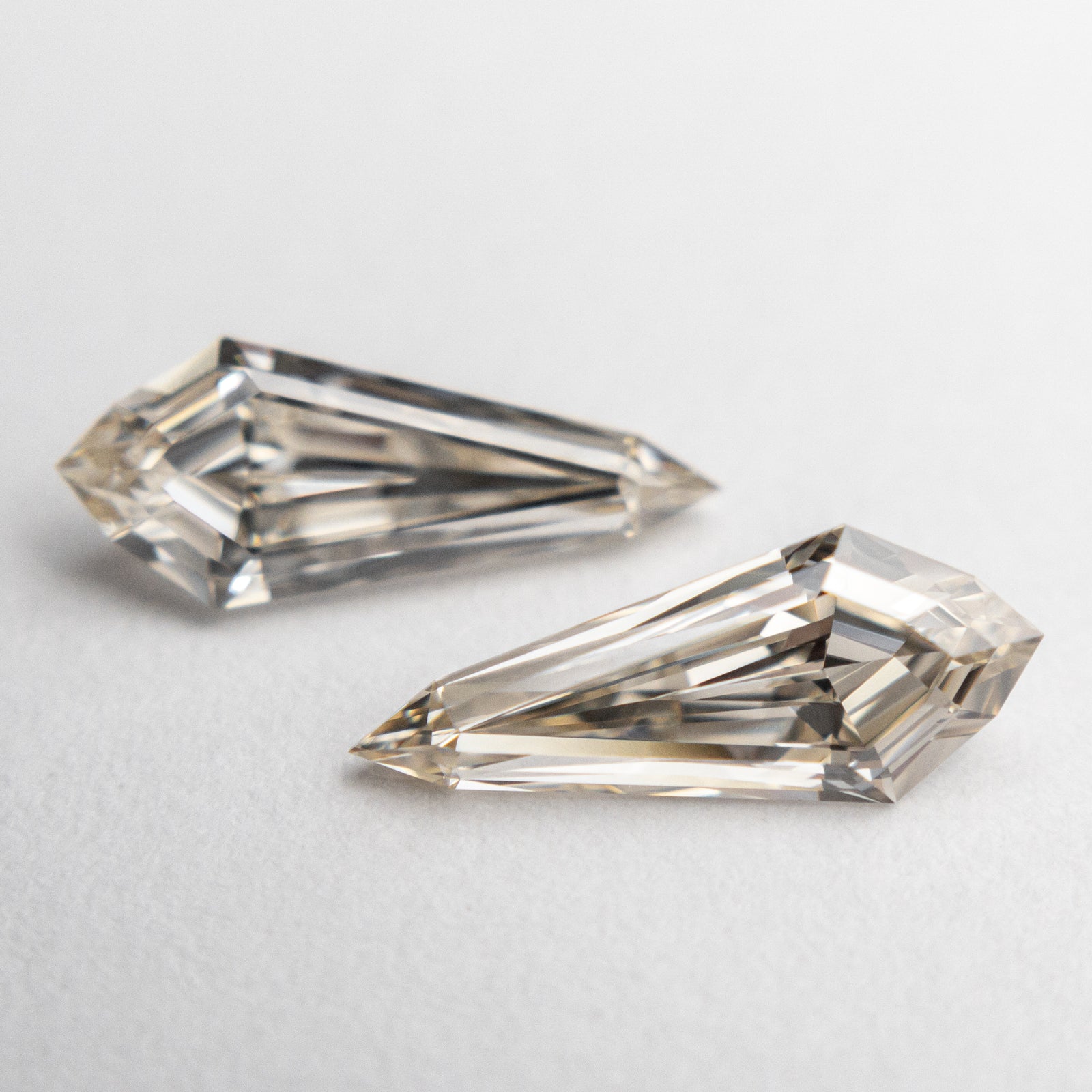 1.44cttw 10.82x4.39x2.77mm VVS Champagne Kite Step Cut Matching Pair 18876-01 - Misfit Diamonds