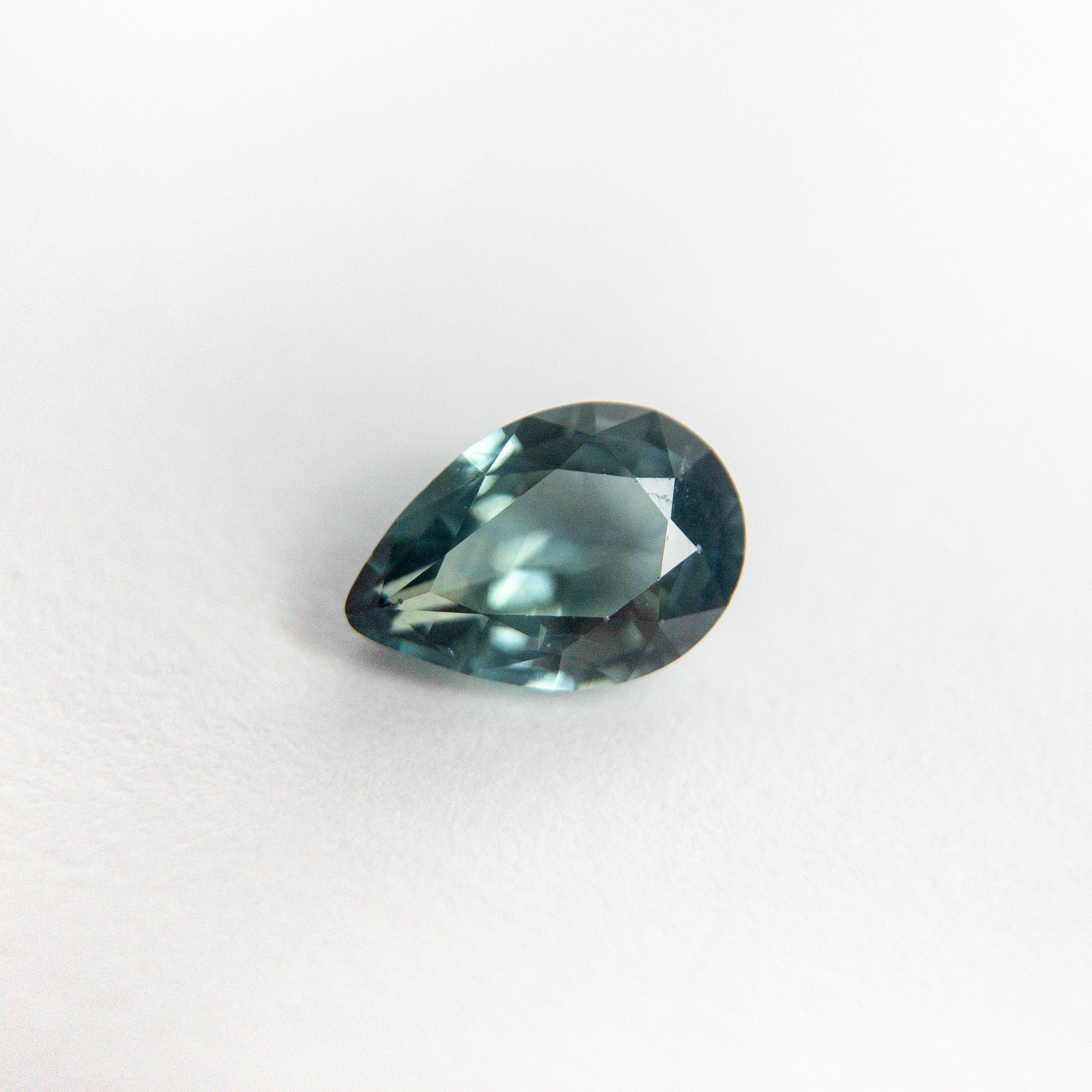 0.63ct 6.49x4.50x2.65mm Pear Brilliant Sapphire 18973-14 - Misfit Diamonds