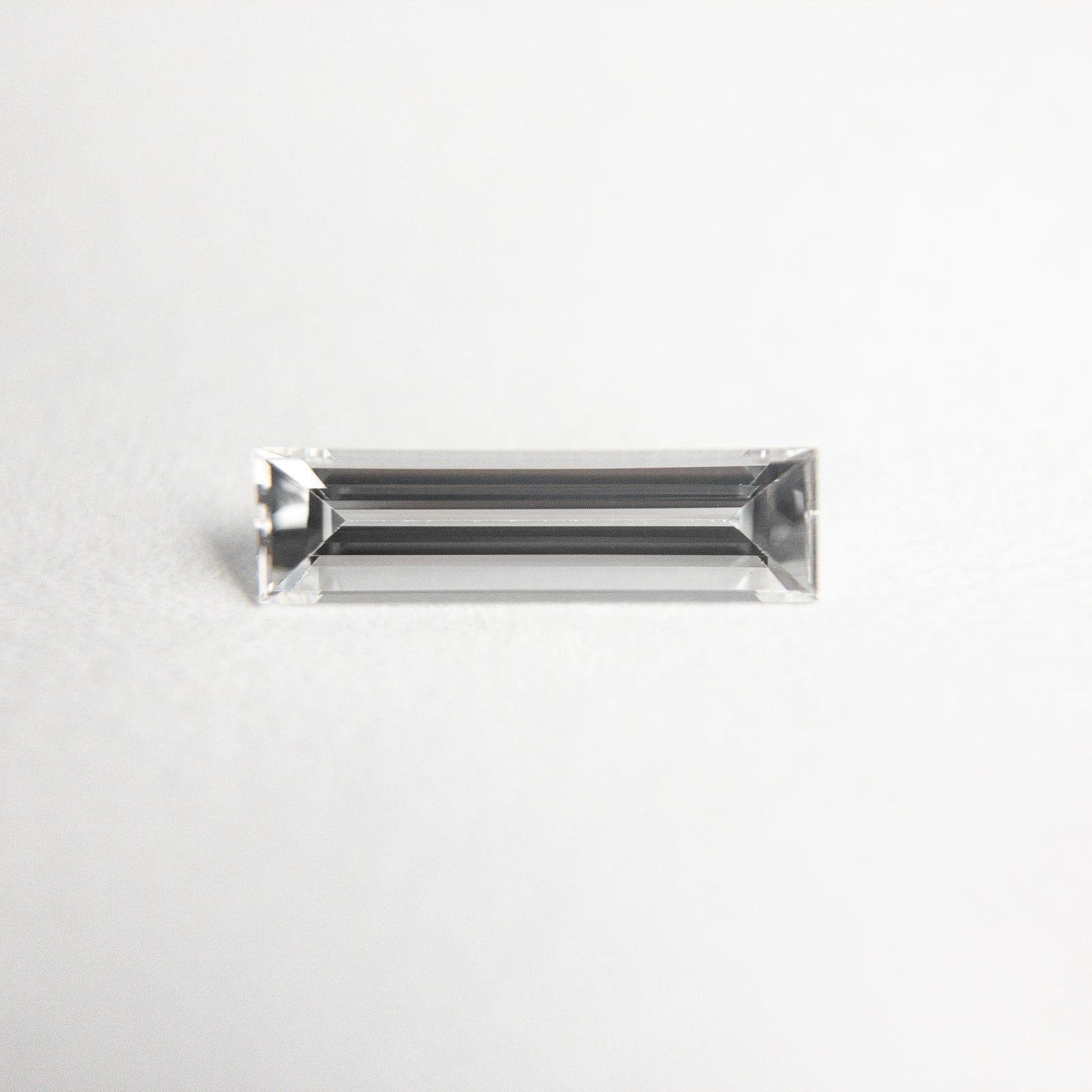 0.28ct 8.52x2.35x1.47mm Baguette Step Cut 19010-01 - Misfit Diamonds