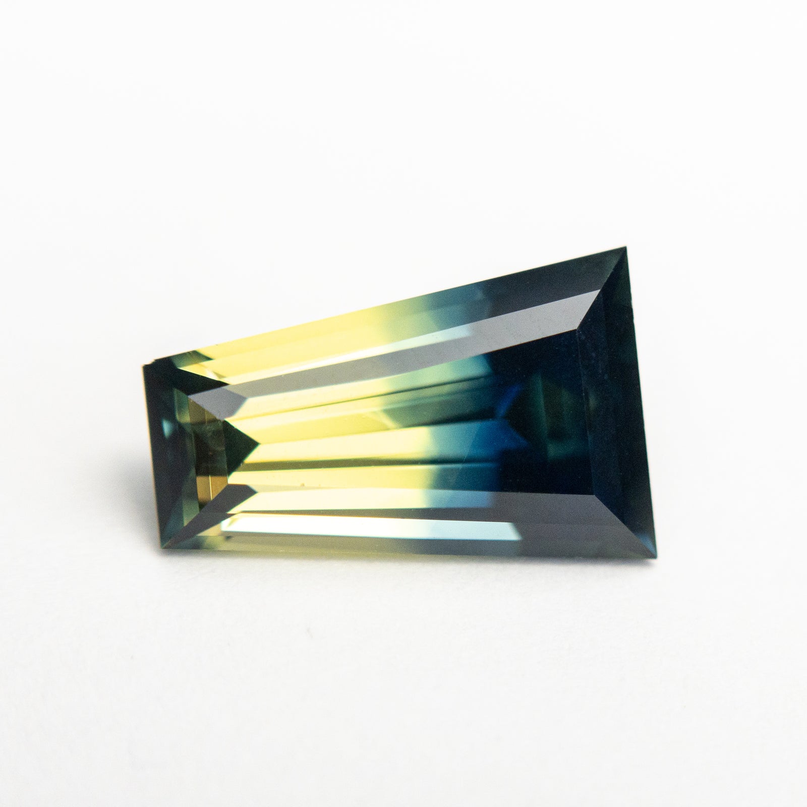 3.25ct 11.48x7.40x4.80mm Tapered Baguette Step Cut Sapphire 19147-04 - Misfit Diamonds